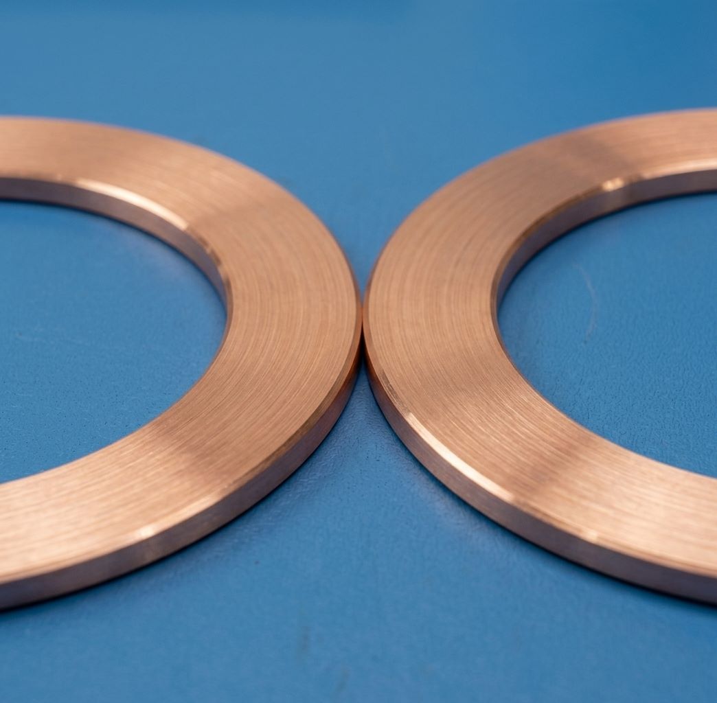 Precision pure copper CNC machining of OFHC vacuum flange gaskets with a smooth surface finish